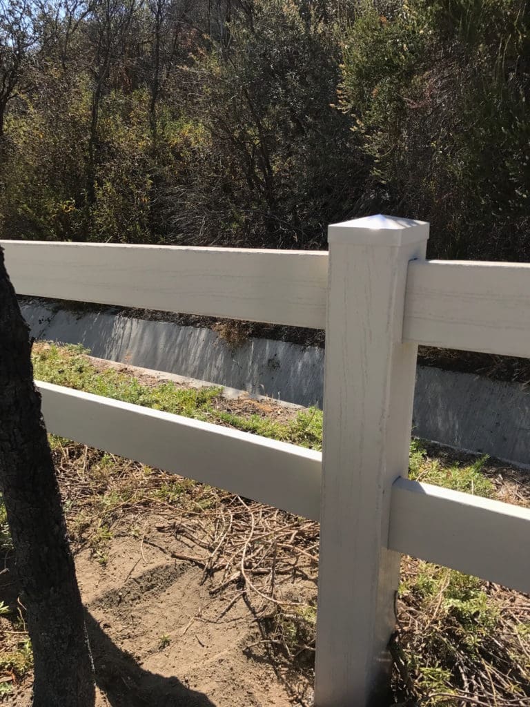 Two Rail tan embossed Vinyl fence