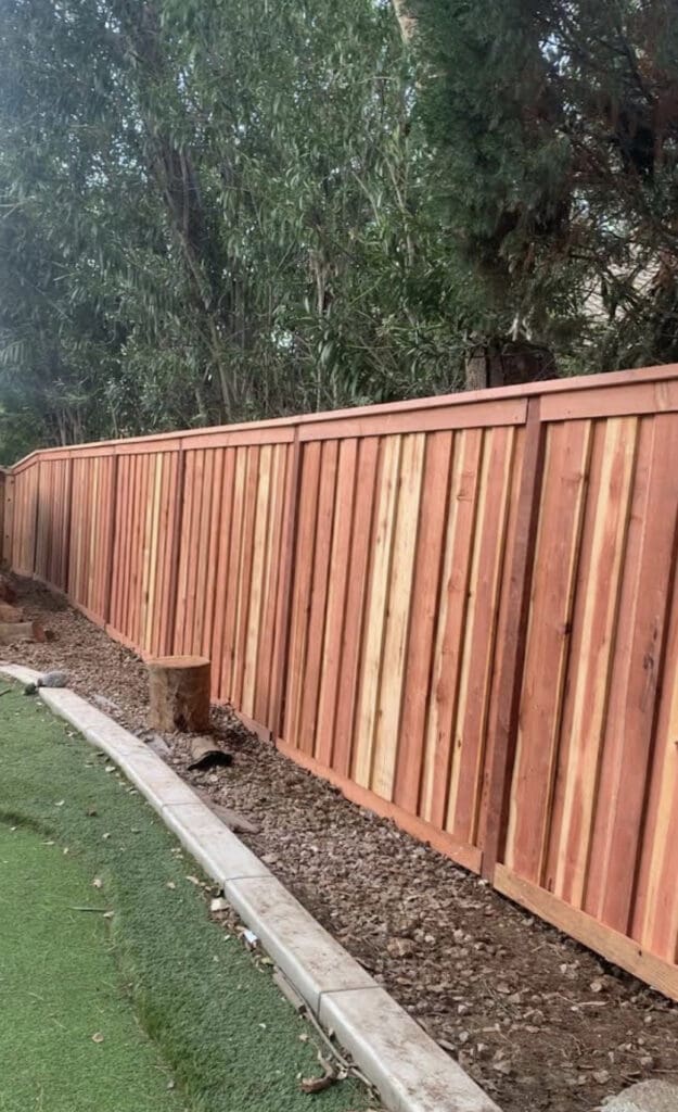 Redwood cap & trim Fence